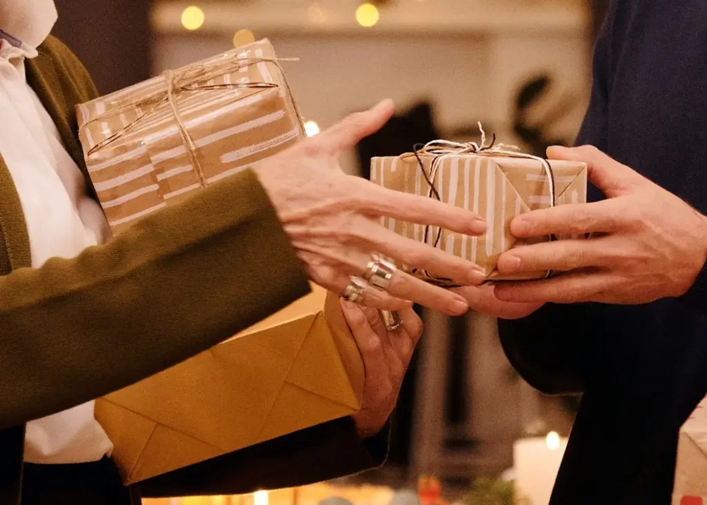 A couple shares gifts for the Holidays