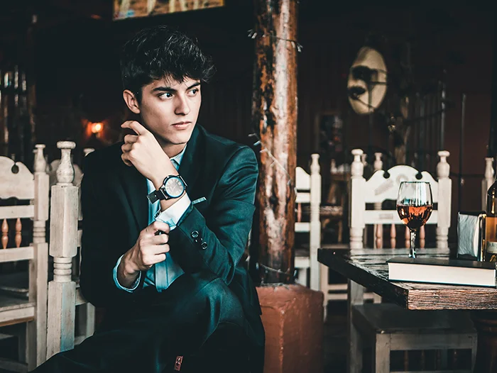 A man wearing a chic and elegant outfit to a Valentine's Day date