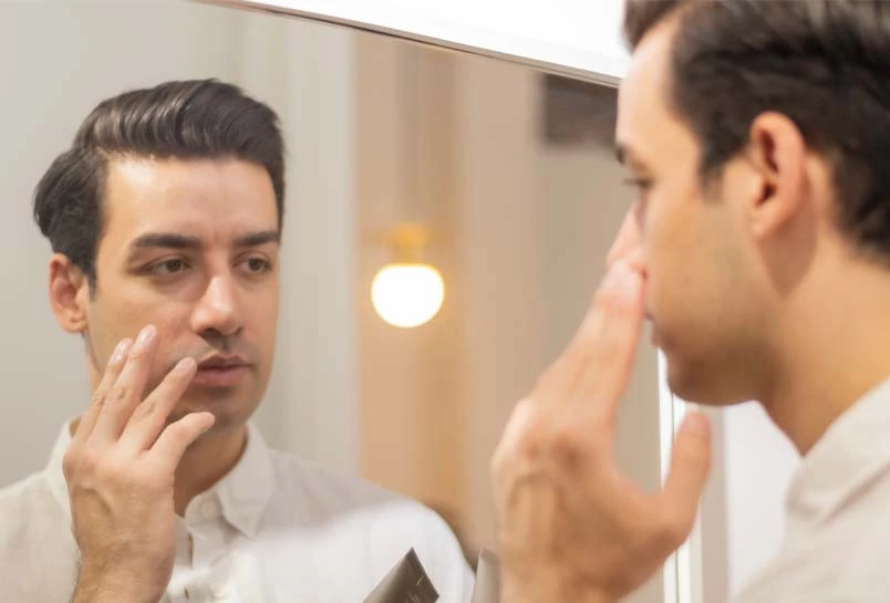 Businessman Grooming his Face