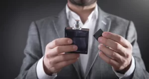 A man applying perfume