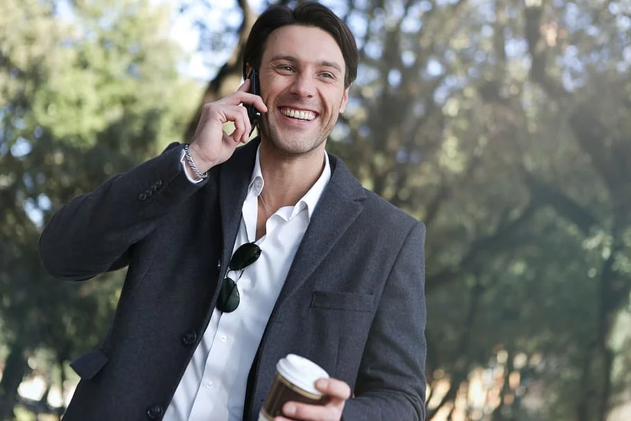 A confident man smiling