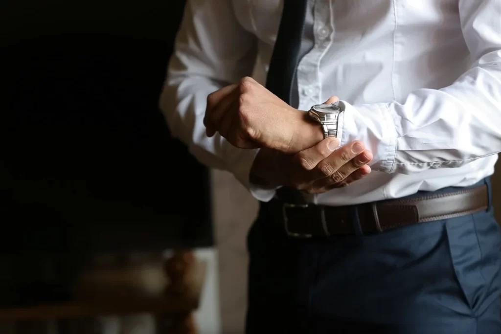 A man wearing a suit with accessories