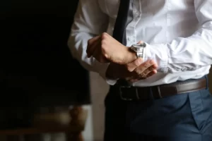 A man wearing a suit with accessories