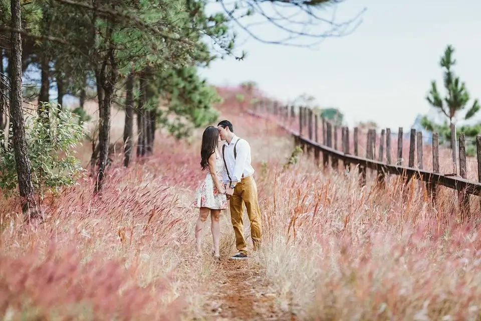 A couple kisses on a spring date